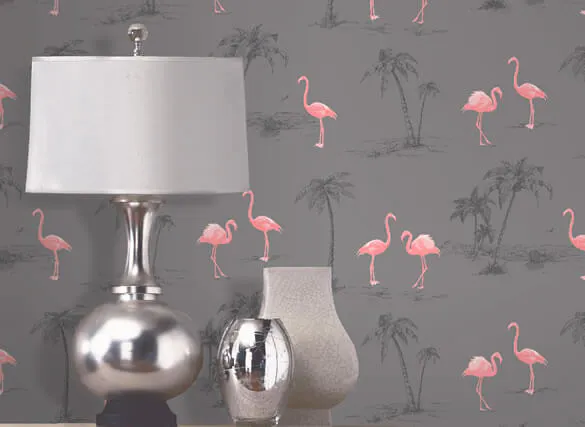 Table laps in front of a grey wall with pink flamingos