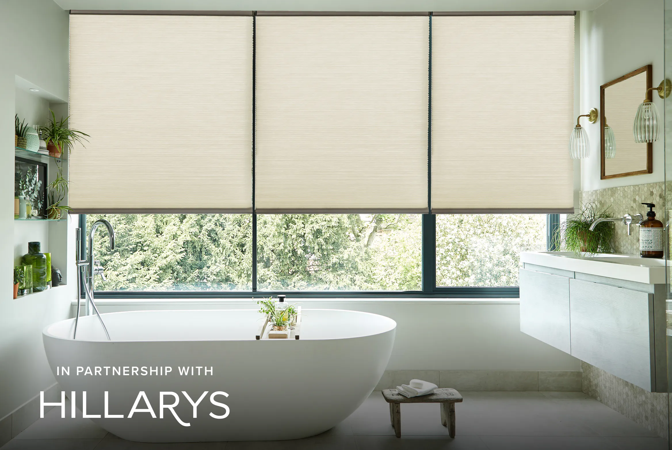 Cream Duette® honeycomb blinds on large window in light modern bathroom 