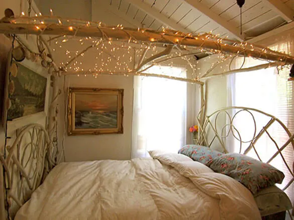 Cosy bedroom with fairylights canopy and Duette blinds for light control