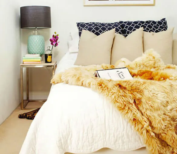 Cosy bedroom with faux fur throw