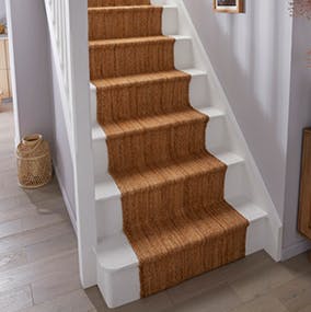 A picture of a completed stair runner installation