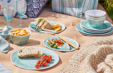 A picnic setting laid out on the grass