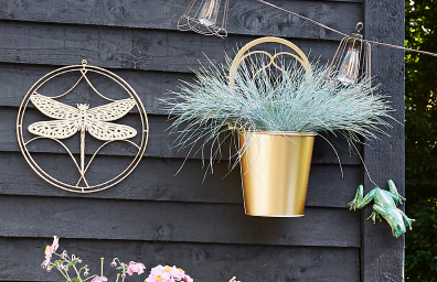 Various garden decorations mounted on a wall
