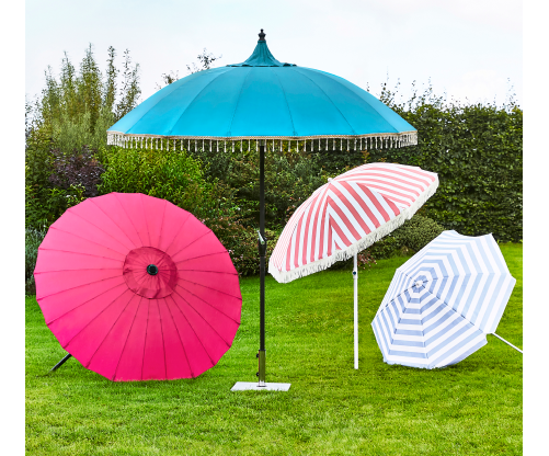Four parasols arranged outdoors, providing shade over different areas