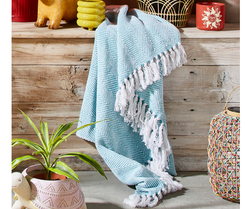 An outdoor throw draped