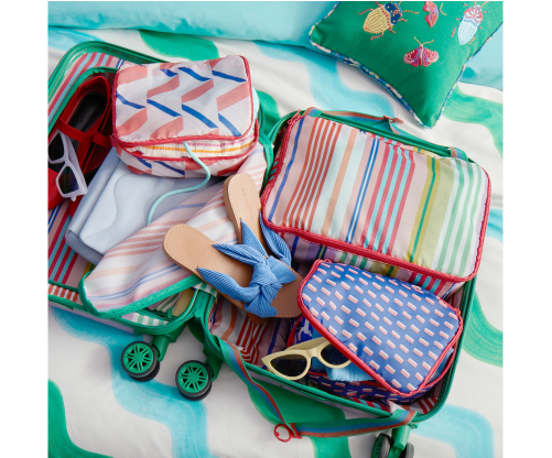 A mixture of travel bags designed for organising items inside a suitcase