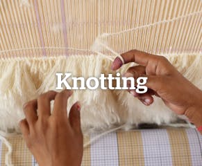 Artisans tie individual knots of dyed yarn into a foundation of strong threads, following the design’s pattern. The density and type of knots determine the rug’s texture and durability.