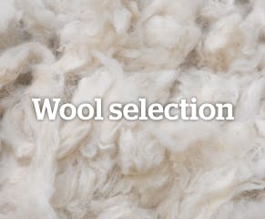 High-quality wool is essential for a durable and beautiful rug – artisans choose wool based on its texture and strength.