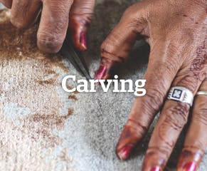 Some rugs feature carved patterns to add depth and texture. This involves carefully hand trimming the pile to create raised and recessed designs.