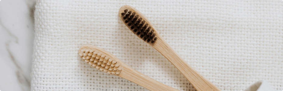 Close up of bamboo handled toothbrushes