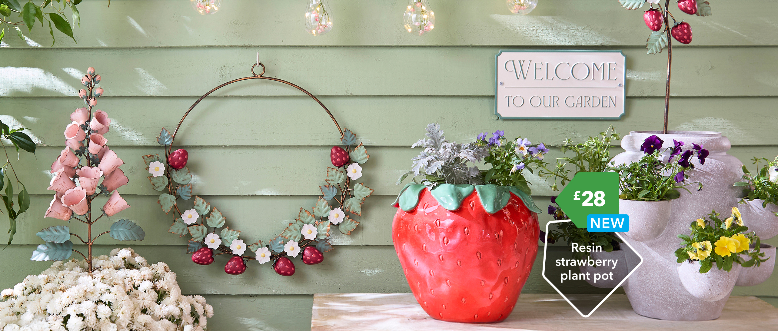 Garden plant pots and welcome sign