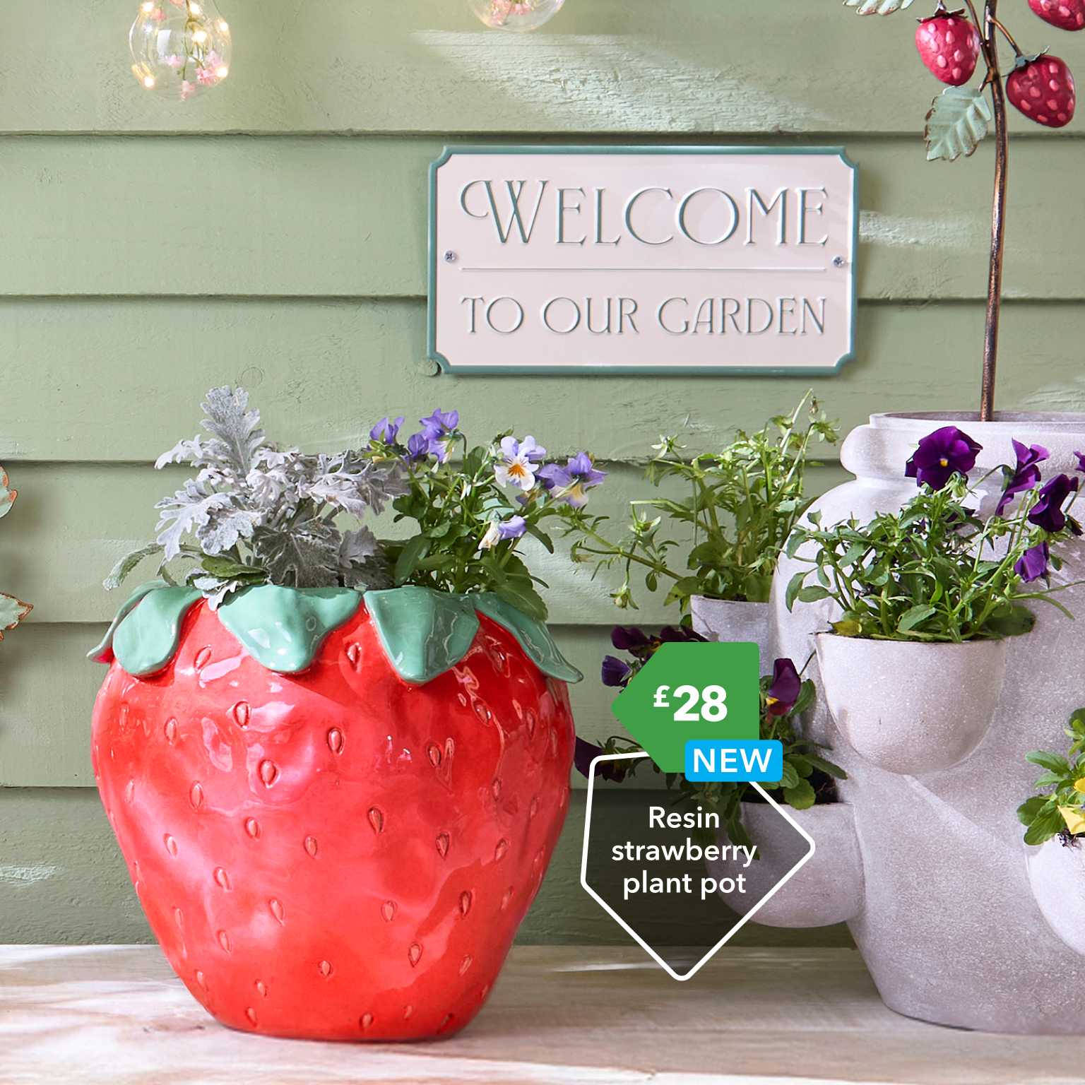 Garden plant pots and welcome sign