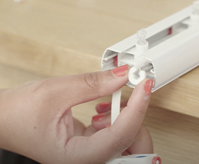 8. Place the plastic locking ring we removed earlier back in front of the glider furthest away from the wand control.