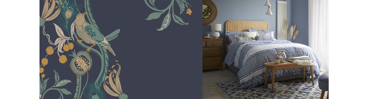 global designed bedding on a textured wooden bed in a blue bedroom