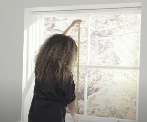 11. Now you are ready to attach the fabric vanes. Measure the required height of the vane by measuring from the bottom of one of the hooks, down to the desired finished height – the window sill in this case. 