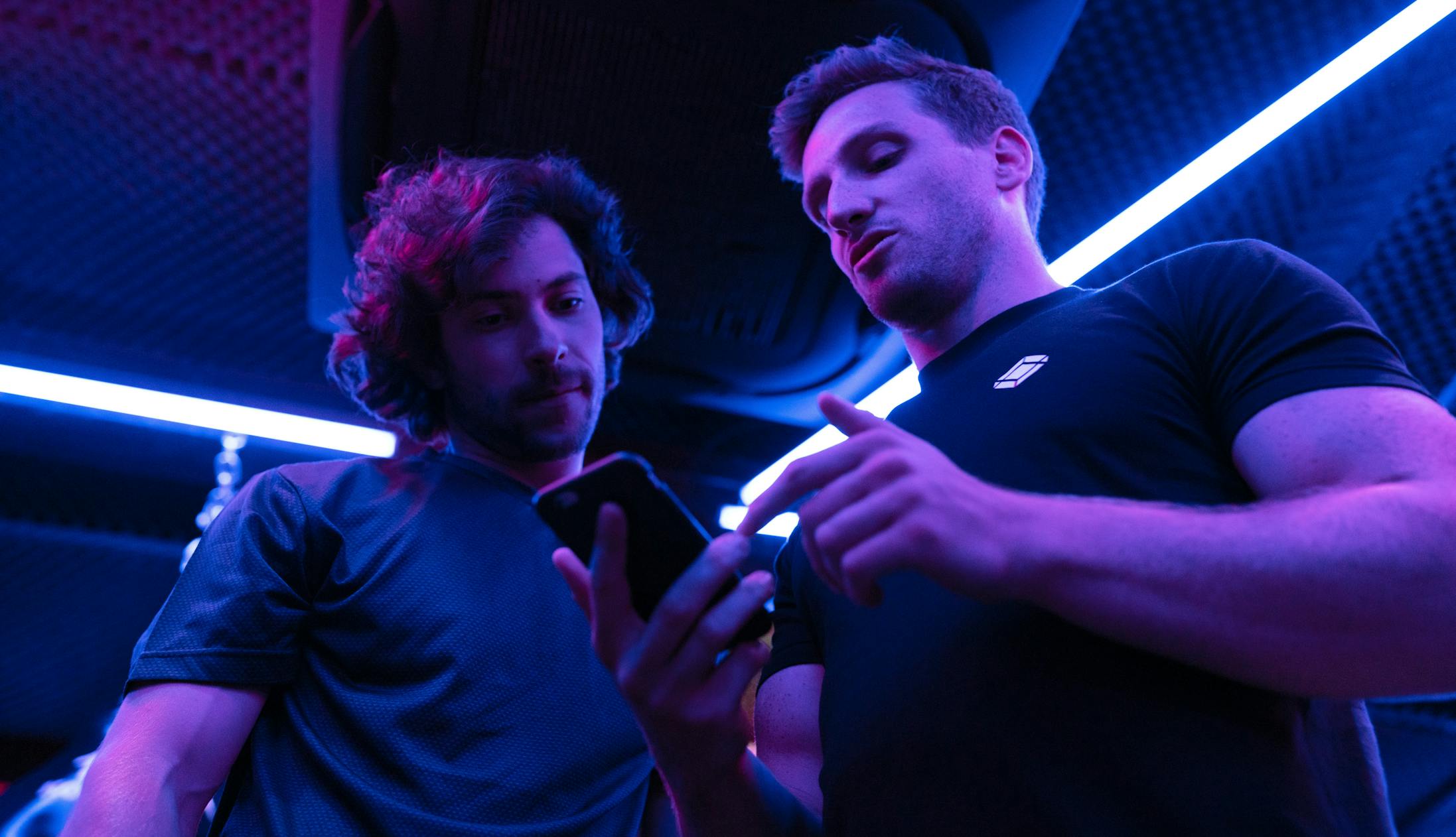 People using an app in the gym