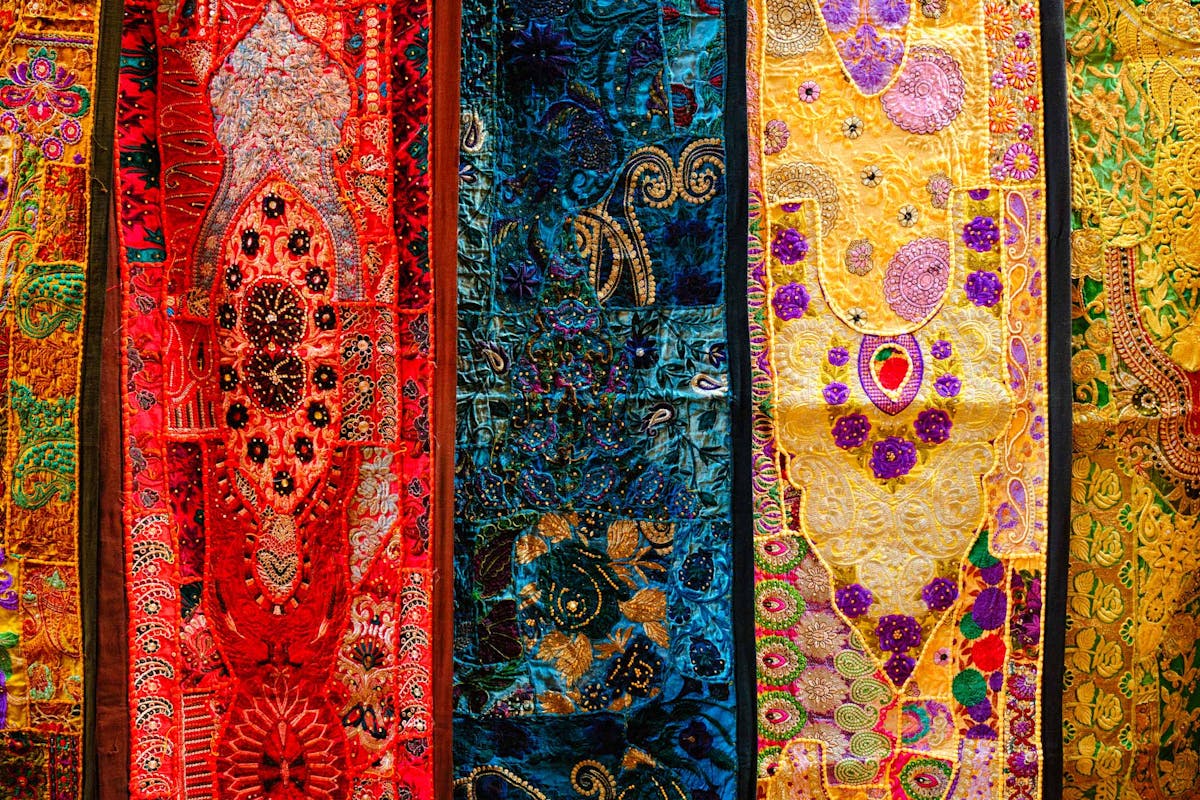  close up details of elaborate traditional textiles in bright colors