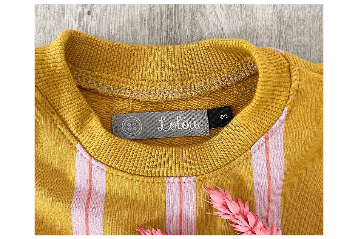 A Woven Label next to a Size Label