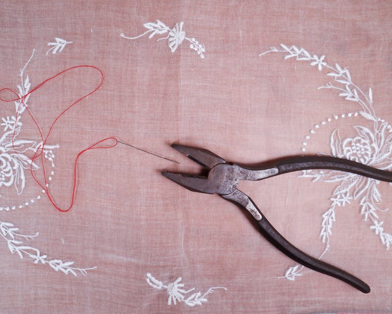pliers and red thread pliers and red thread