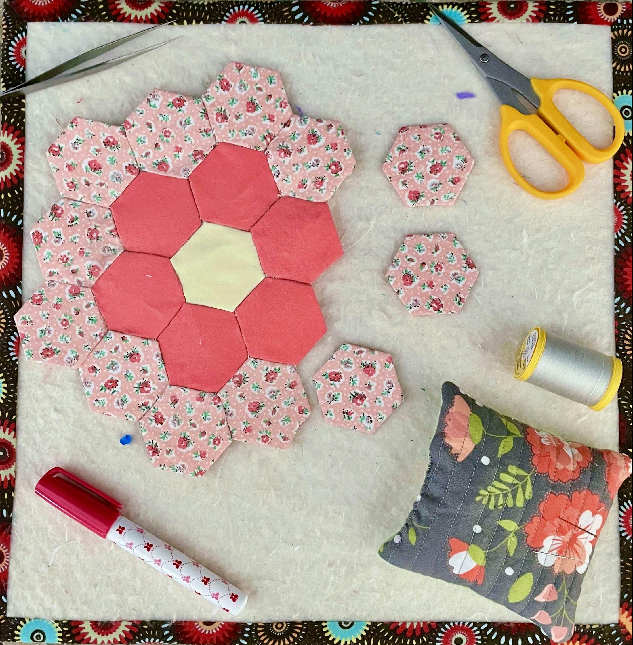  flat lay of miniature quilts in floral pink