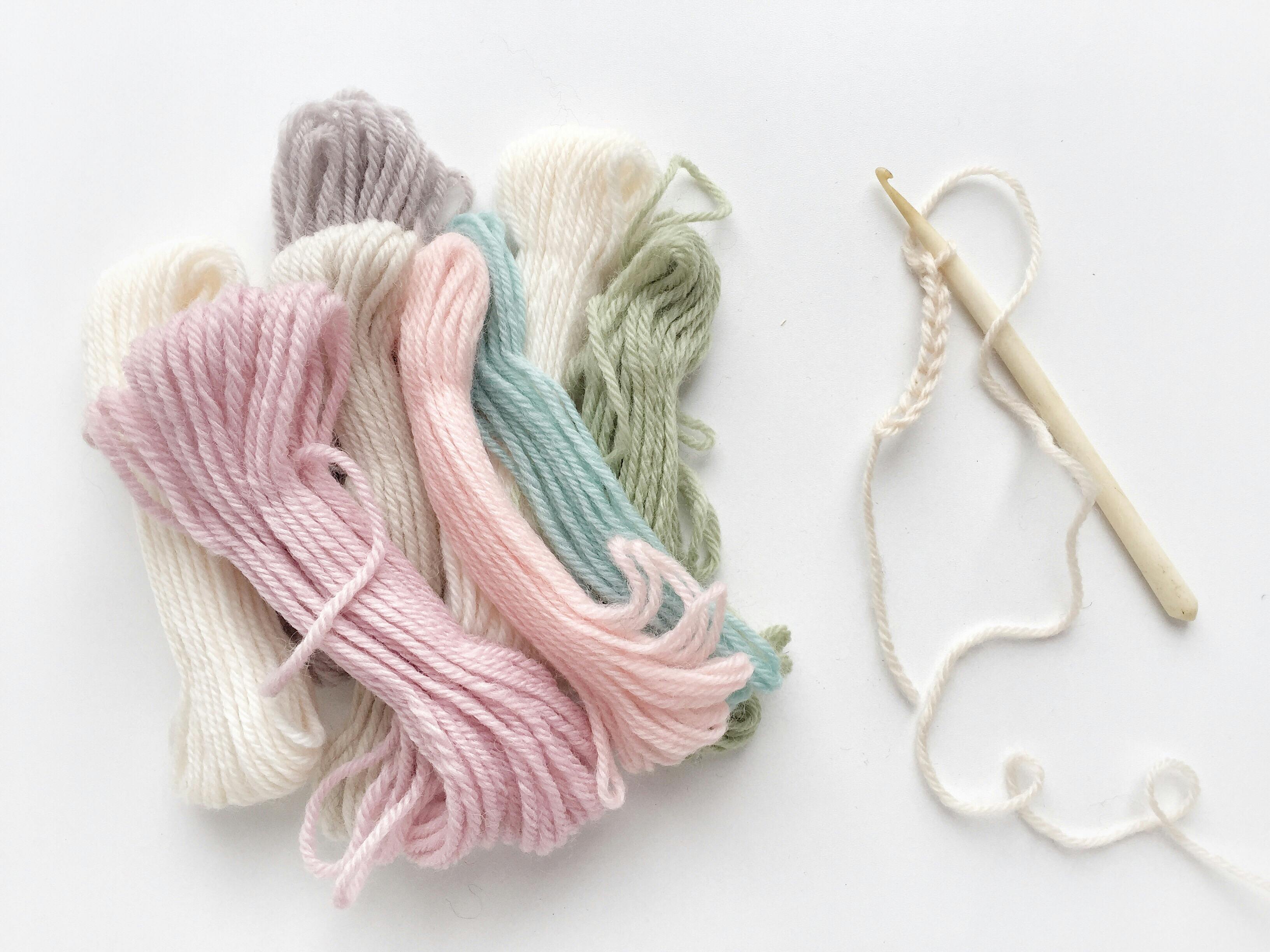  crochet hook with pastel yarns