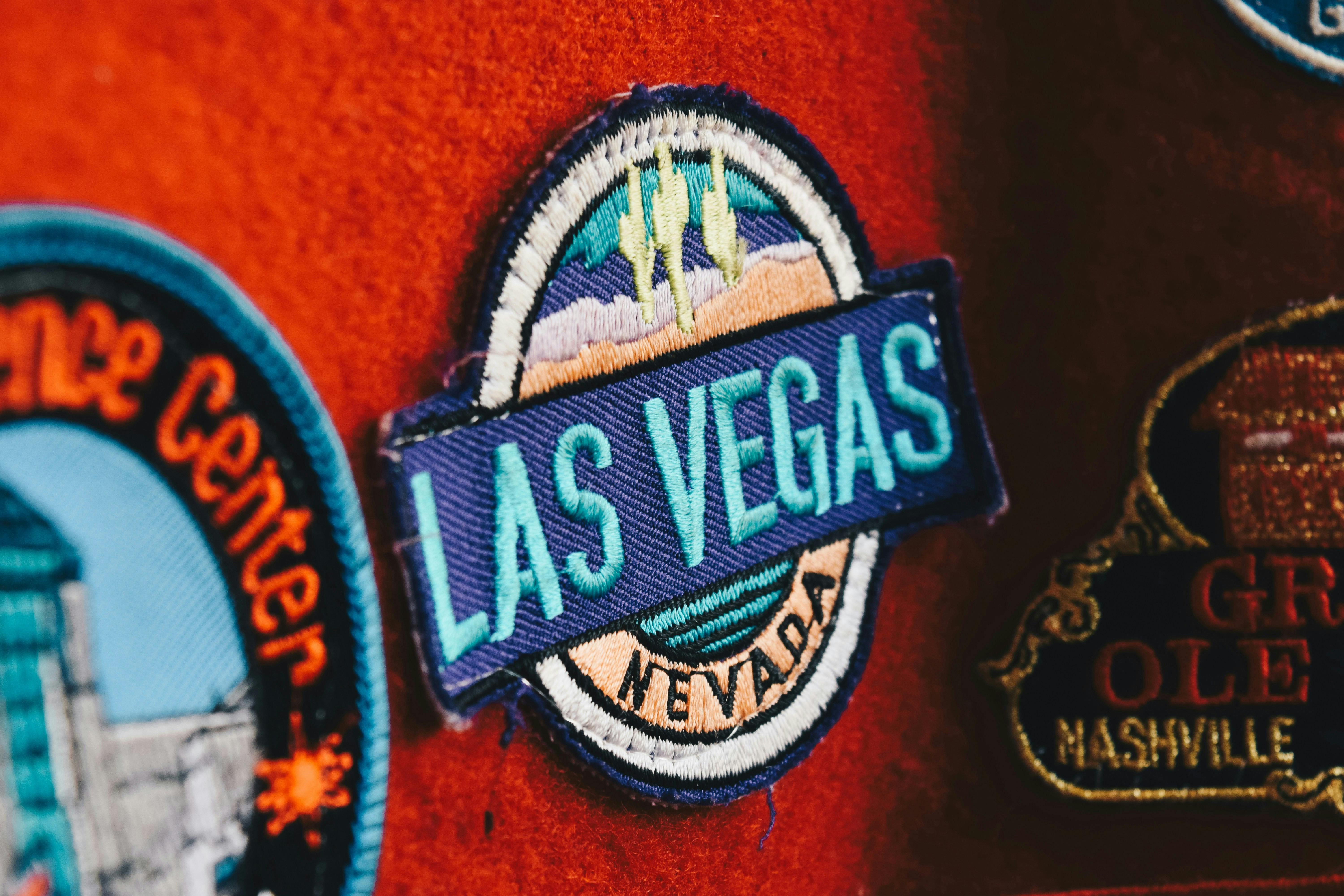  A close-up of an embroidered &quot;Las Vegas&quot; patch on a red fabric background