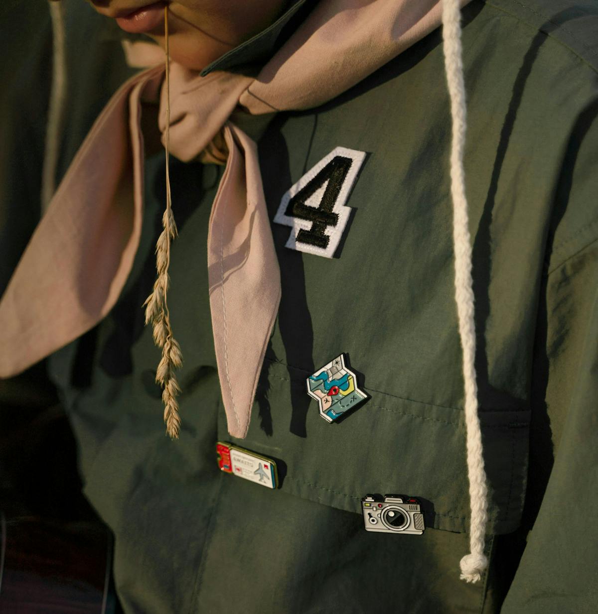 a close up of a scout uniform with patches on it   a close up of a scout uniform with patches on it