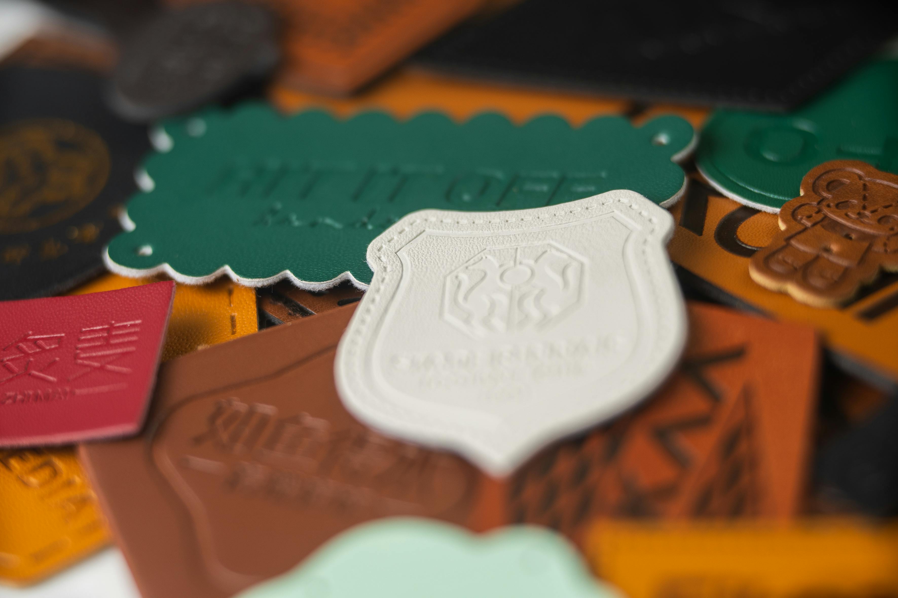  A variety of leather patches in numerous colors, with diverse edging styles and intricate designs.