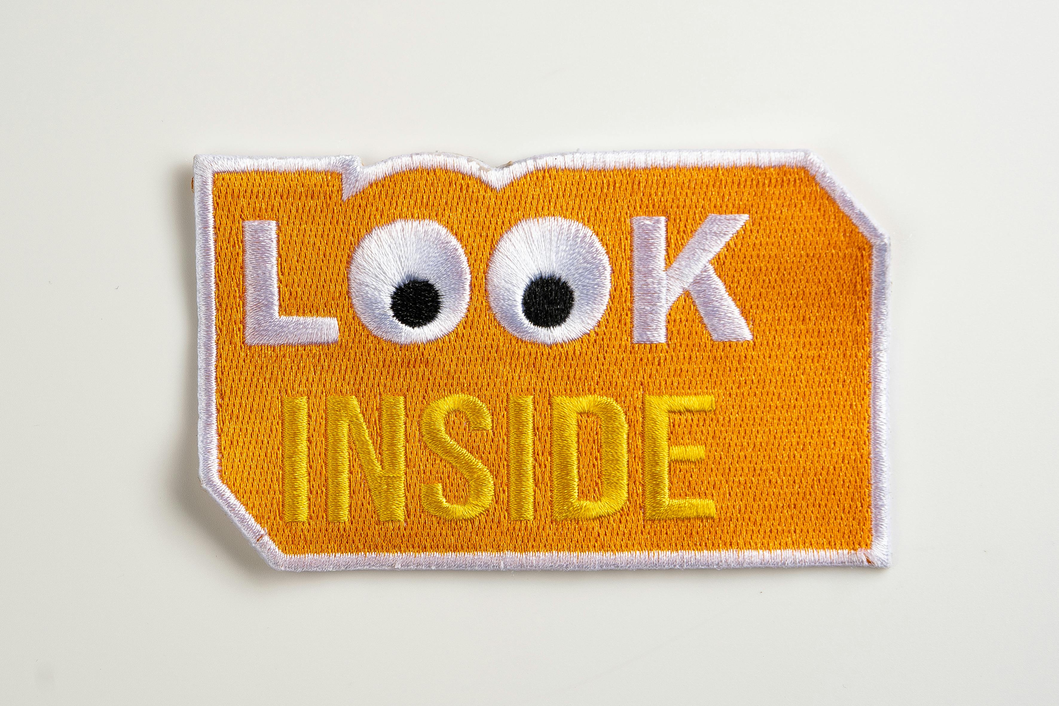  A fun yellow embroidered patch with playful and vibrant design.