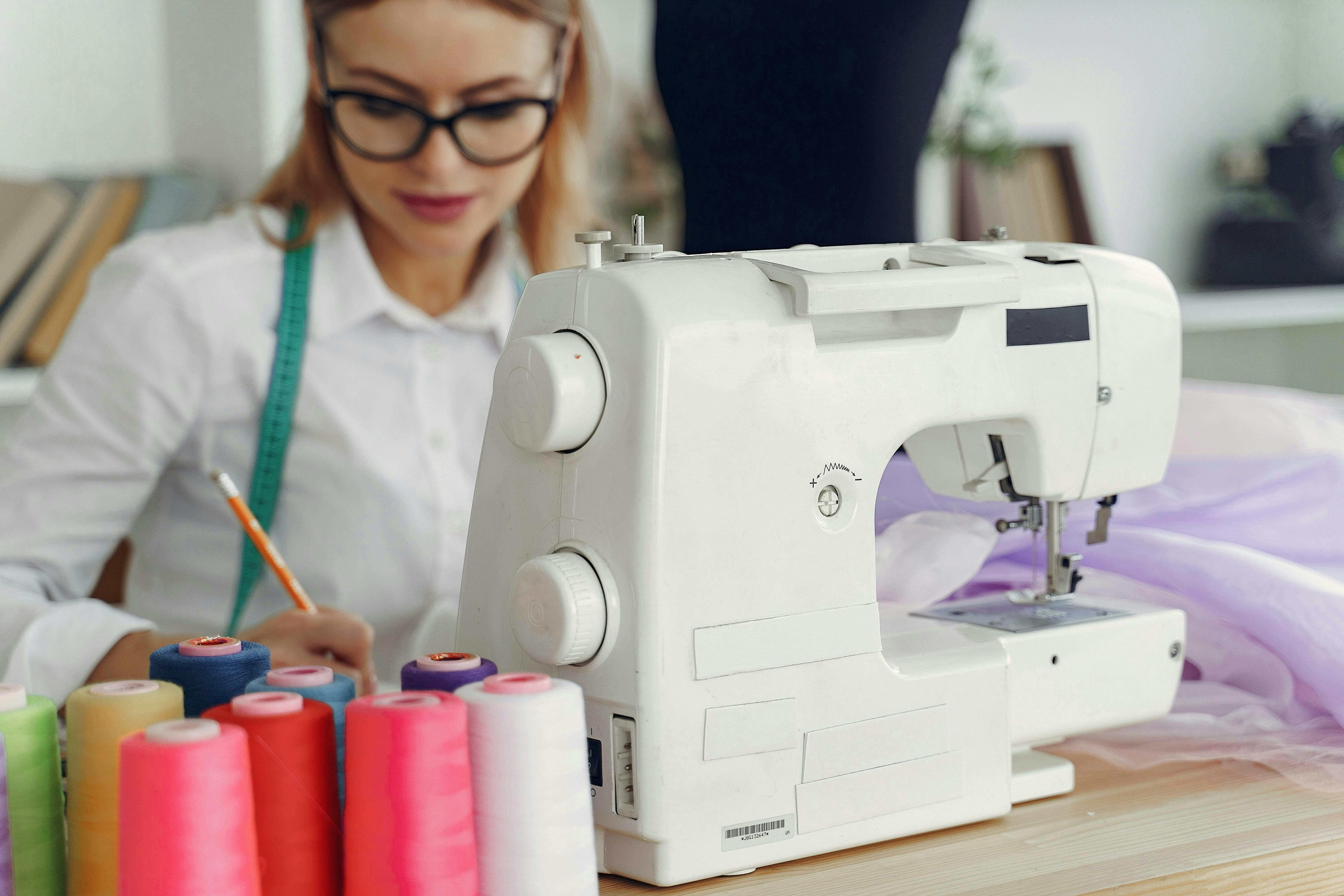  A woman sitting behind a sewing machine