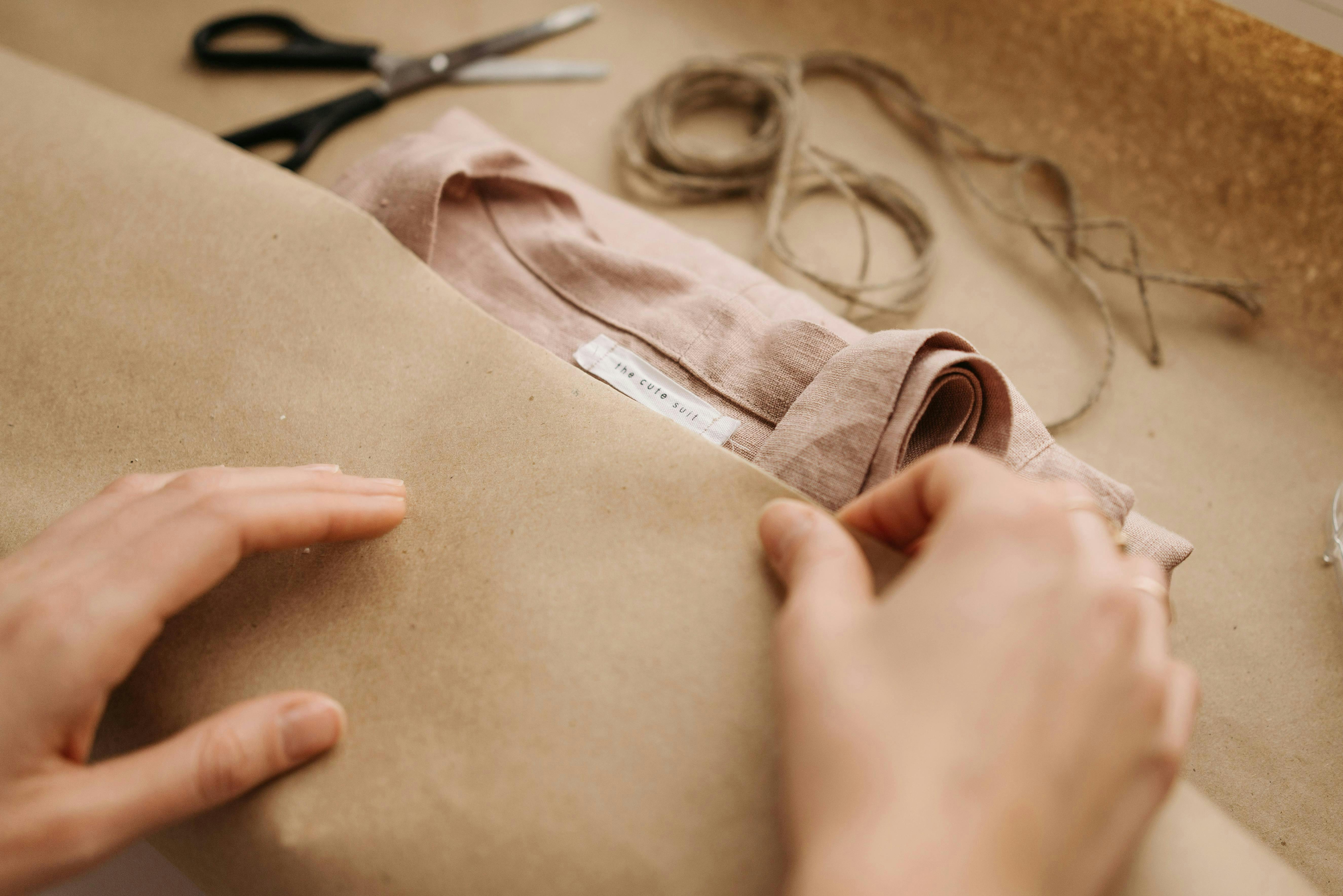  A folded linen garment with a visible custom clothing label