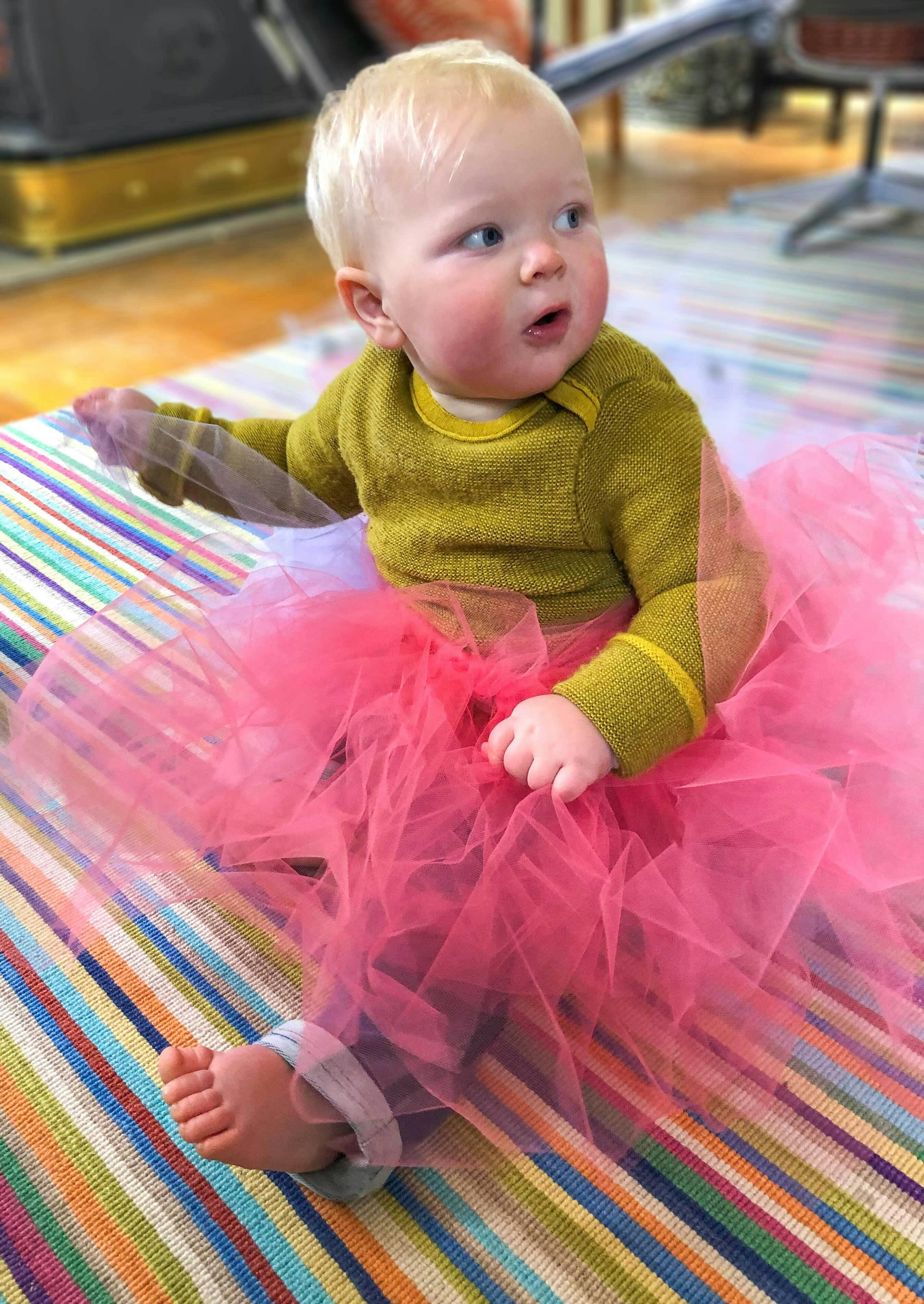  baby wearing a pink tutu 