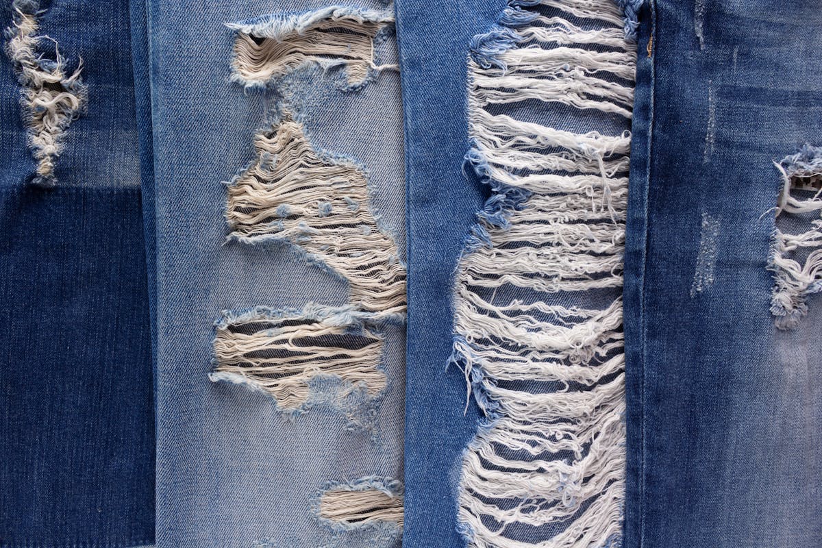  four different types of ripped denim jeans 