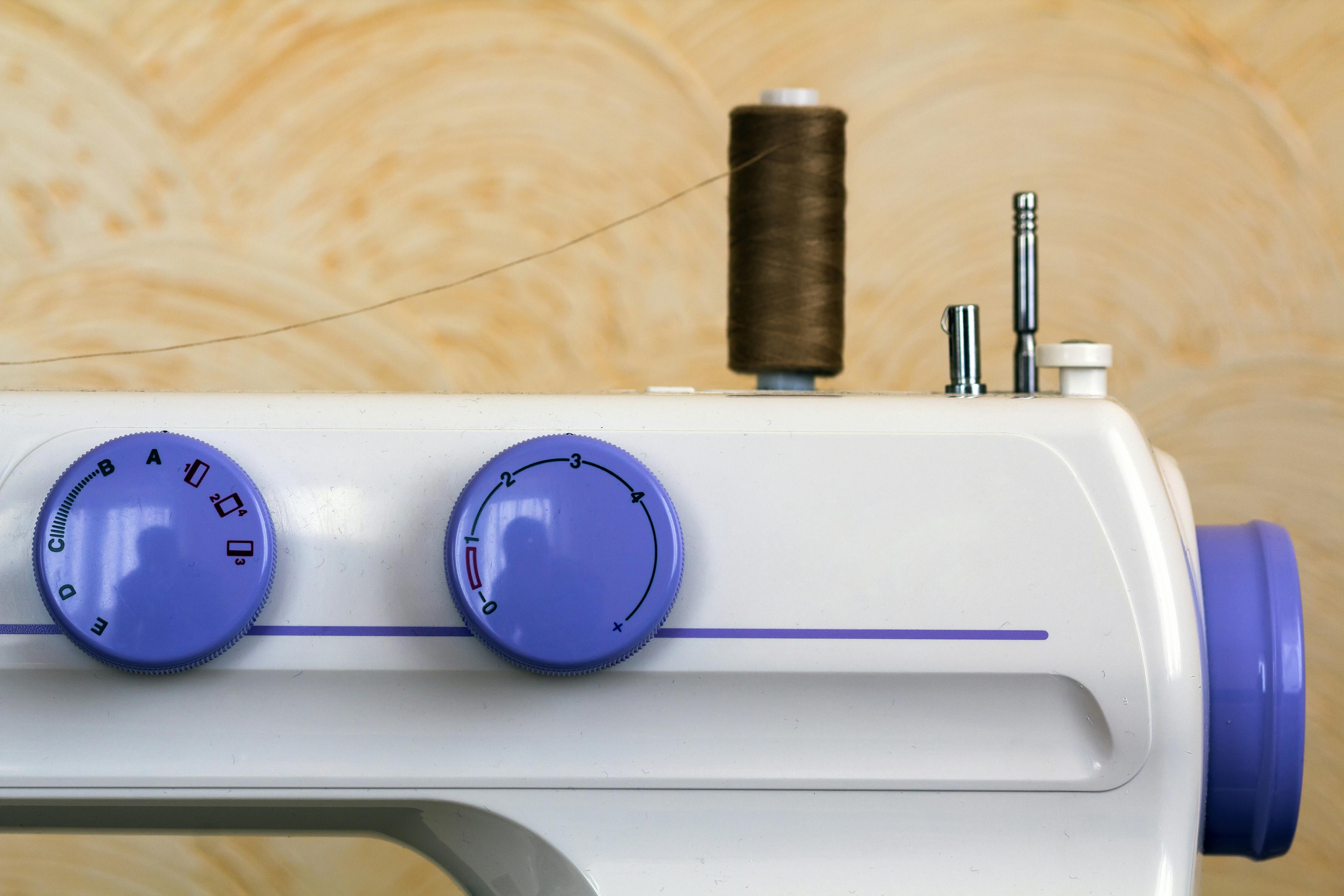 sewing machine dials with thread attached
