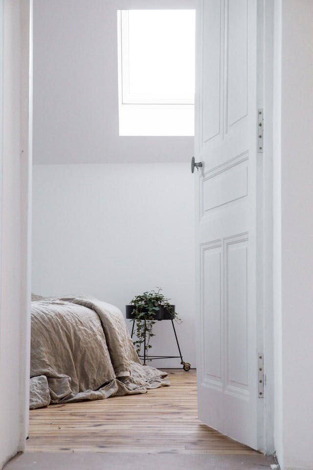  bed made up with draping linen duvet cover as a homemade wedding gift idea