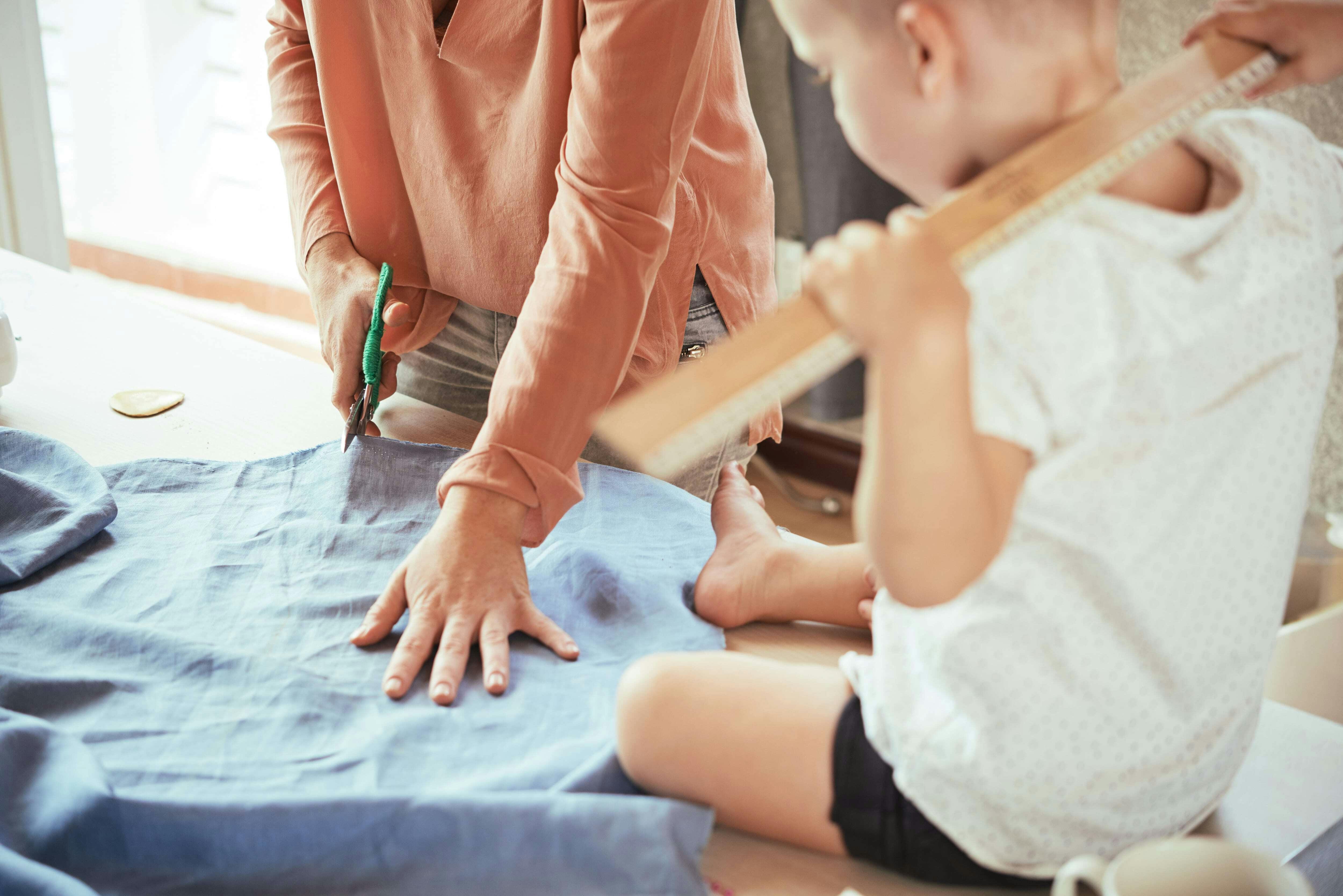  Sewing technique example of Woman and Child Cutting Fabric