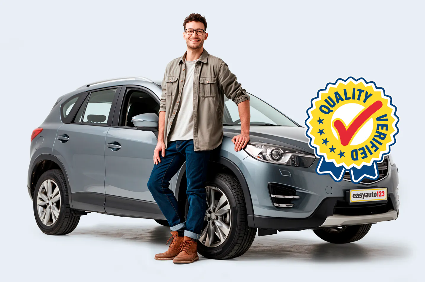 Man leaning against Quality Verified™ grey used SUV from easyauto123