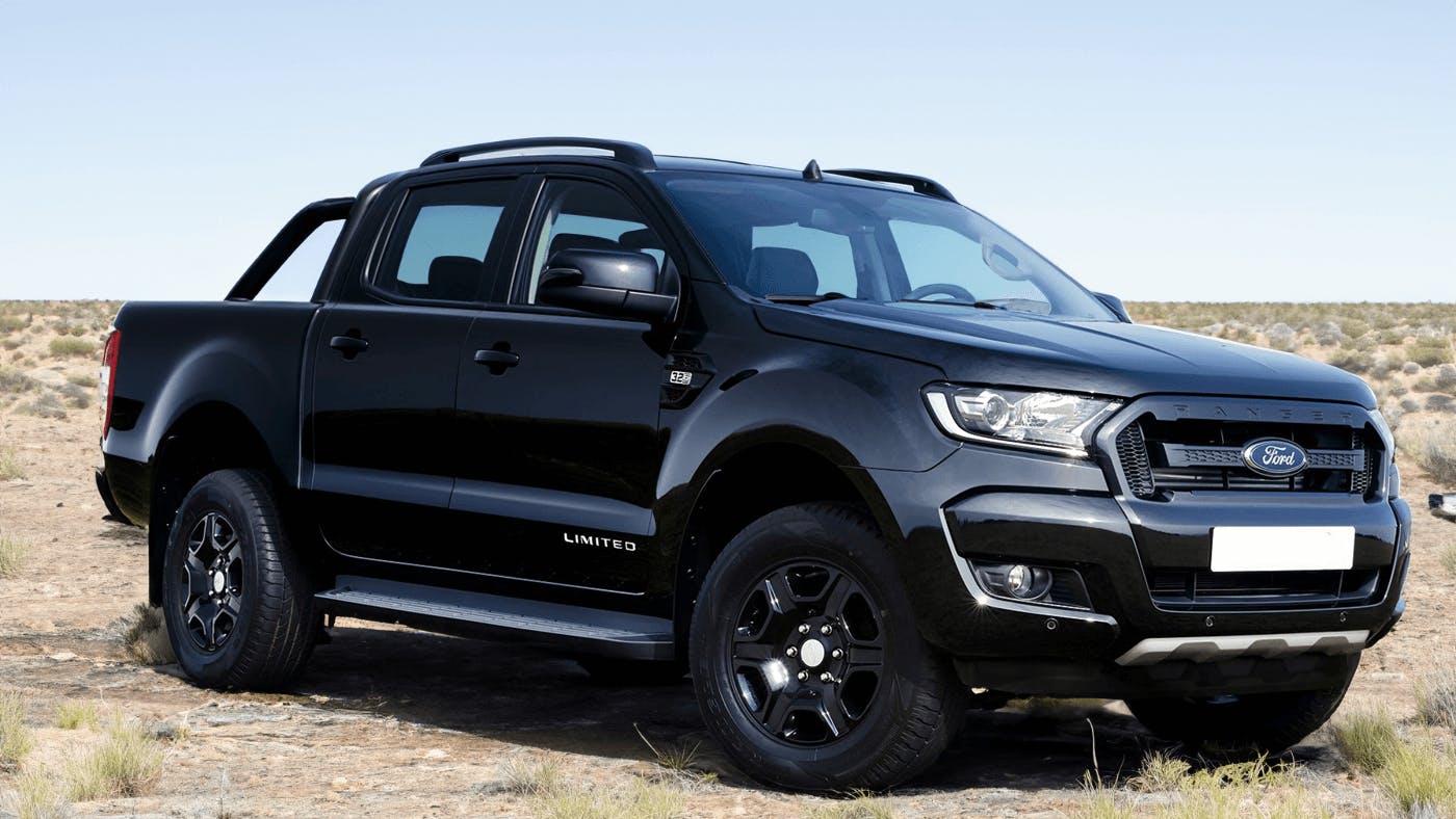 black ford ranger on beach