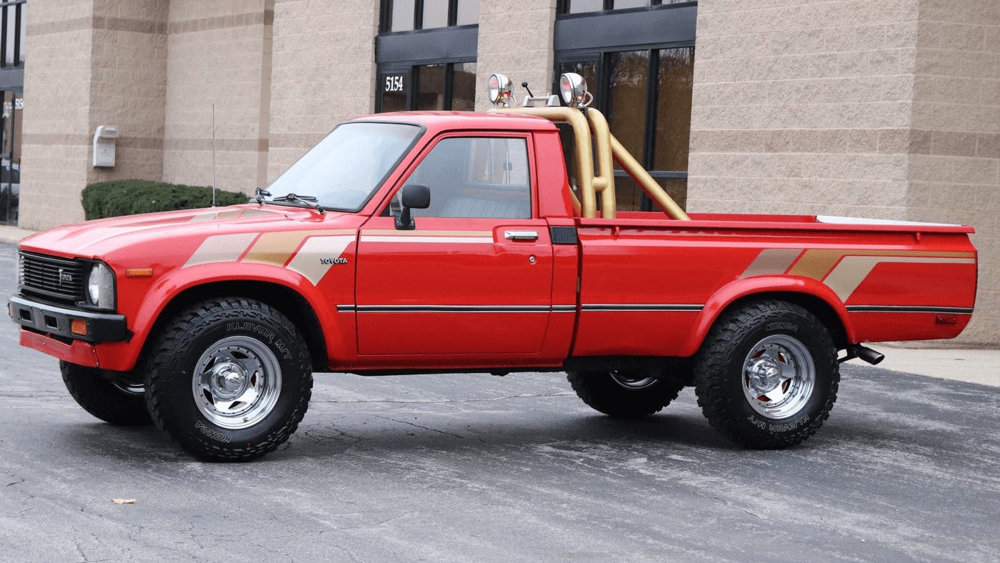 red toyota hilux from the 1980s