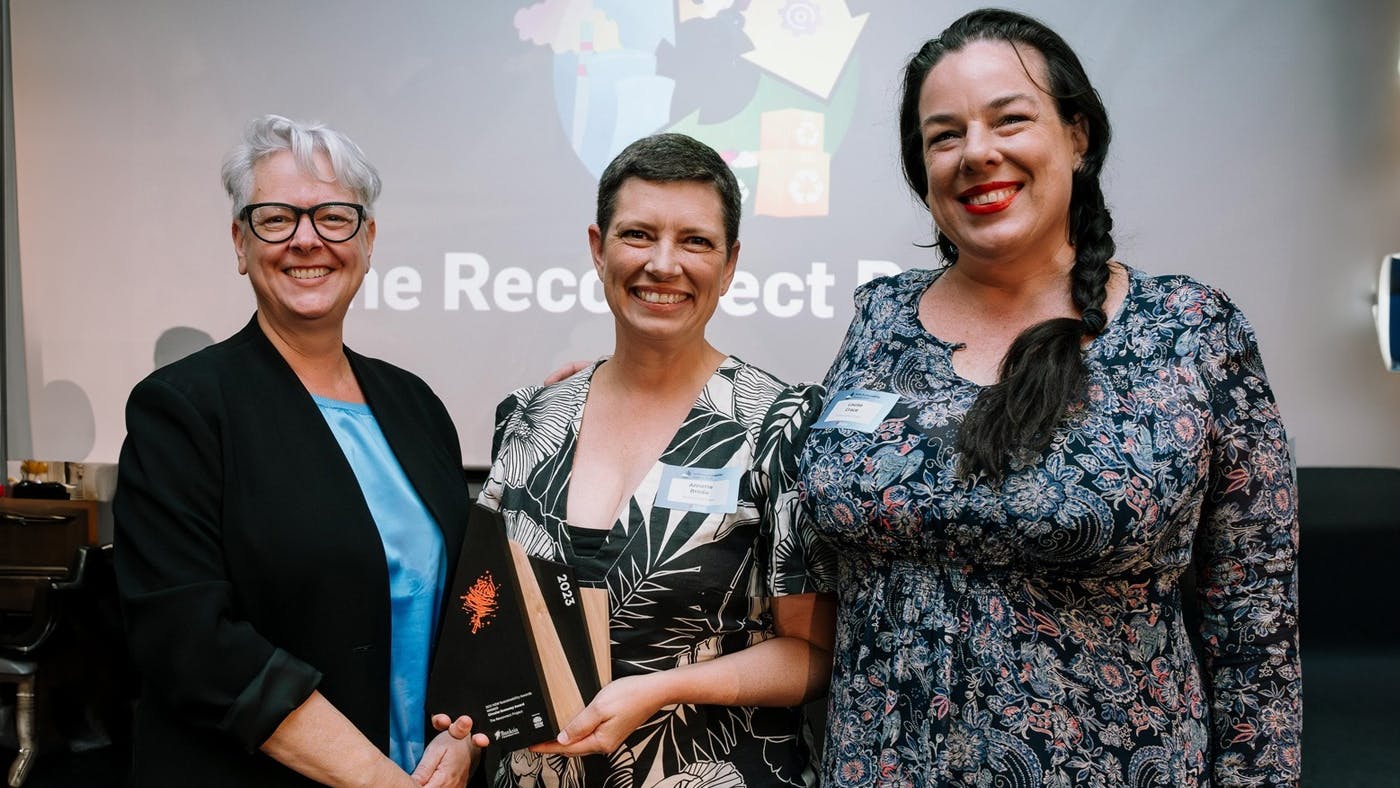 Annette Brodie celebrating an award for the Reconnect Project's work.