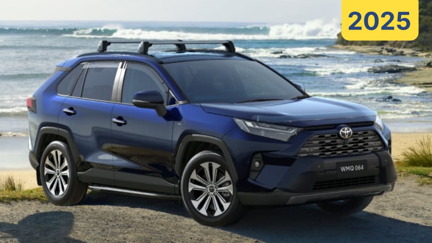 2025 Toyota RAV4 in blue parked by a beach