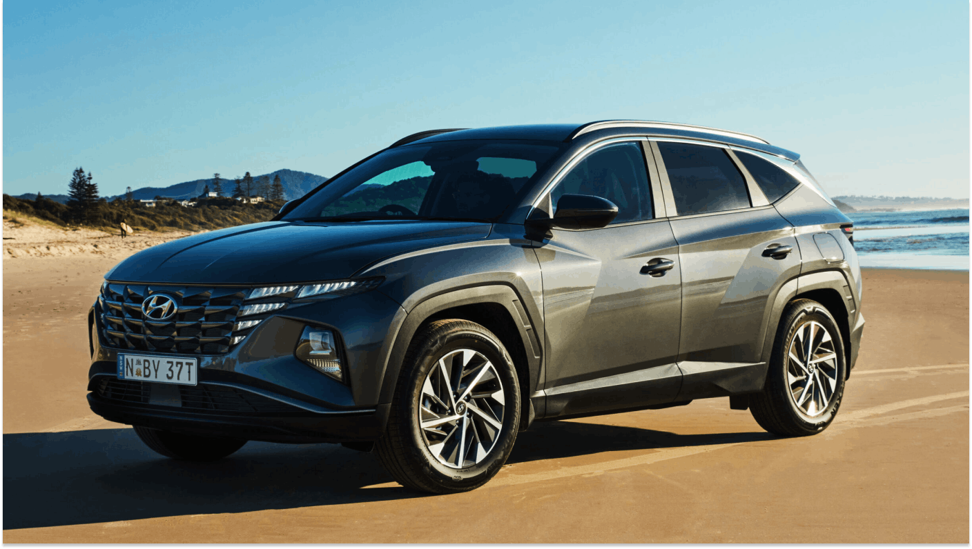 Gunmetal grey Hyundai Tucson paked on deserted beach