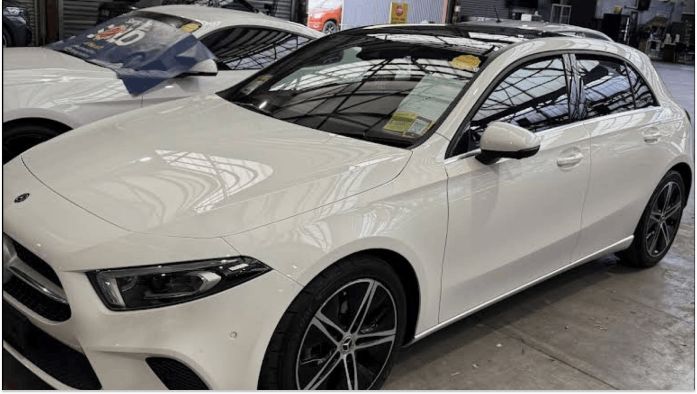 White Mercedes-Benz GLA in used car warehouse