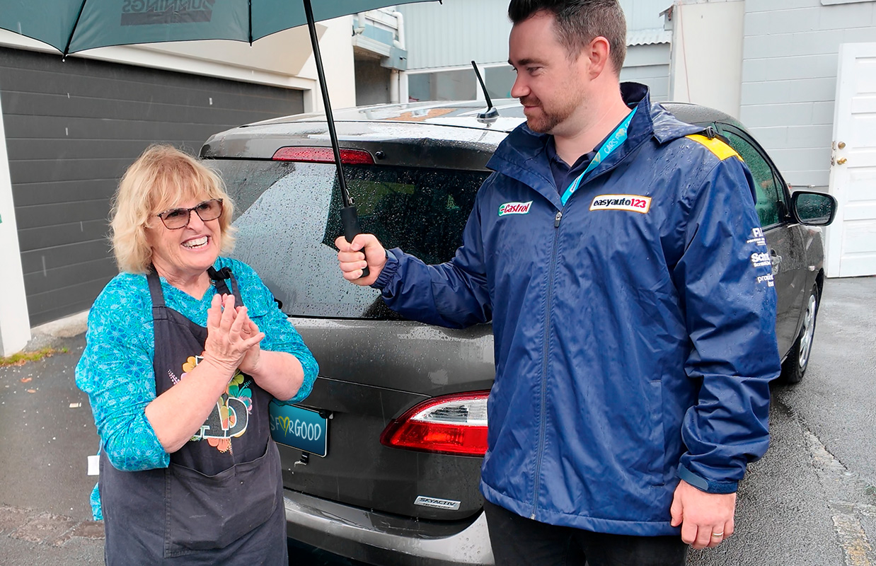 Anne Riley of Kai Avondale reacts to receiving her 2016 Mazda Premacy from  easyauto123 Cars for Good