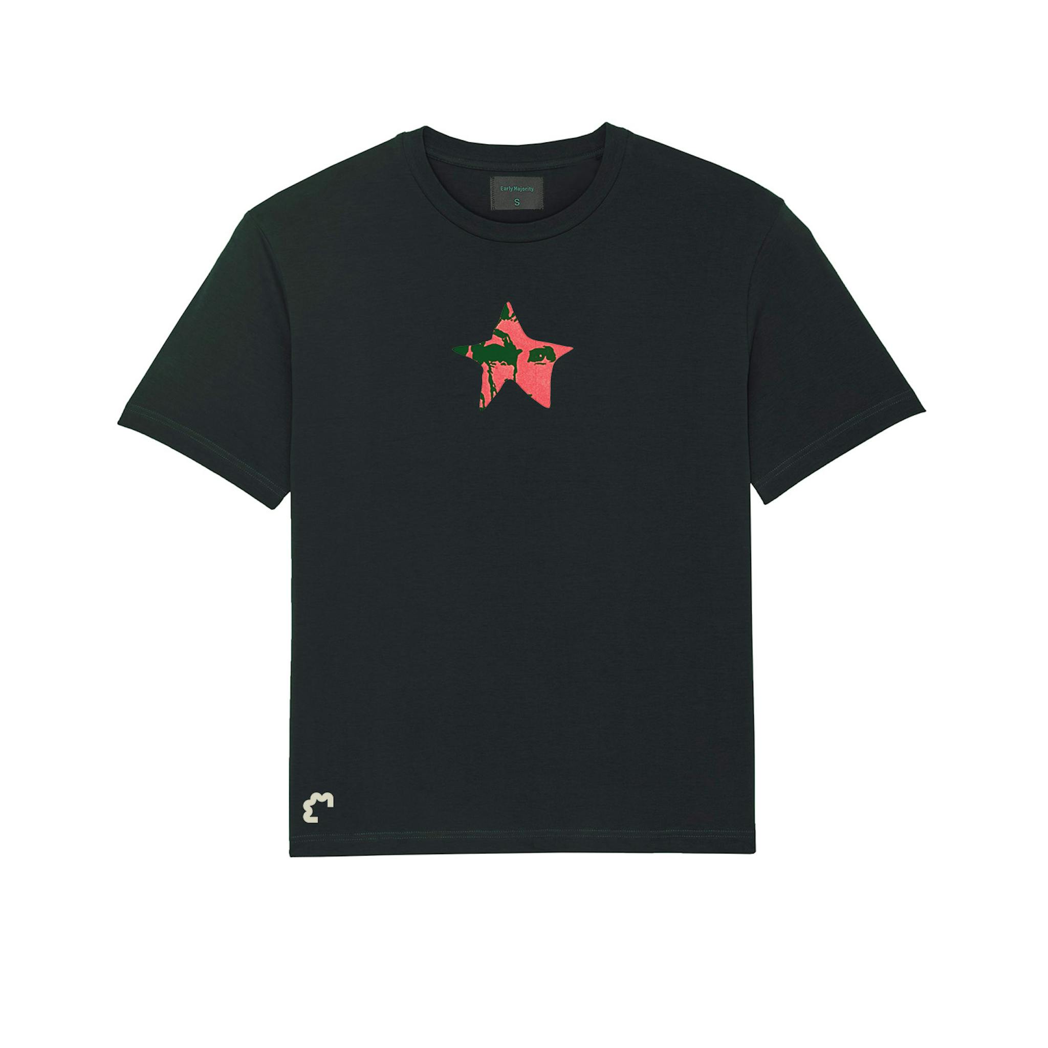 A black T-shirt with a small red star graphic on the front and a small white emblem on the lower right side.