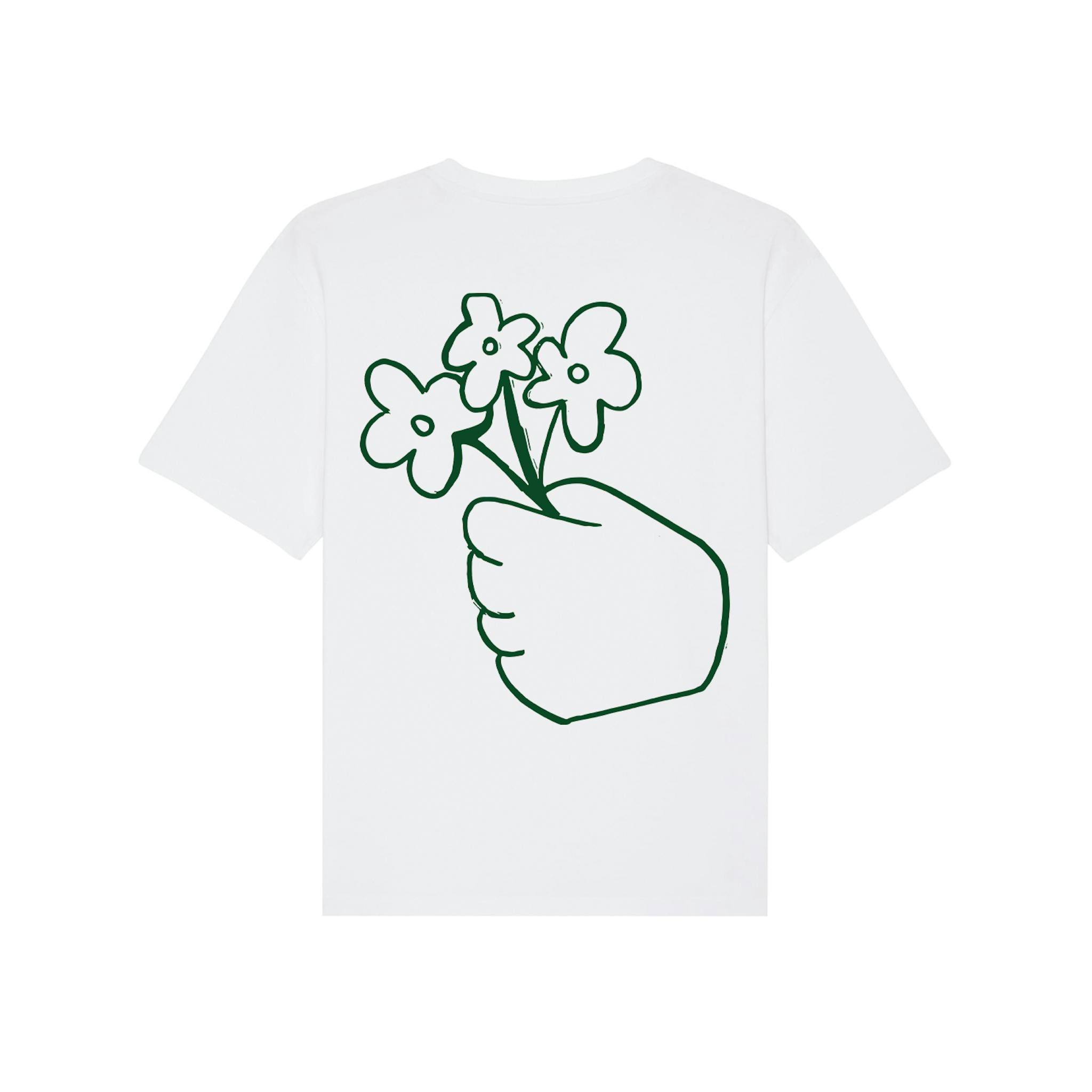 A white T-shirt with a green outline drawing of a hand holding three flowers on the back.