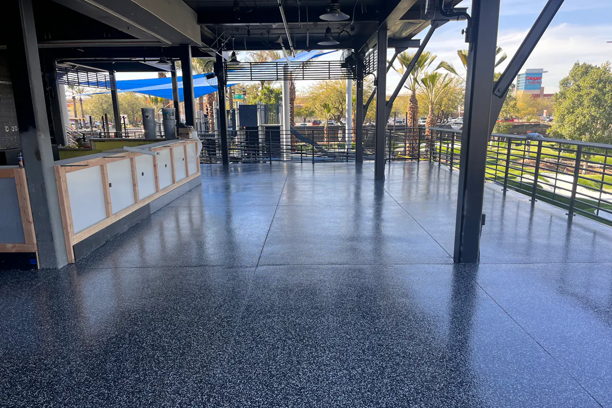 Commercial outdoor patio dining area with flake epoxy floor coating