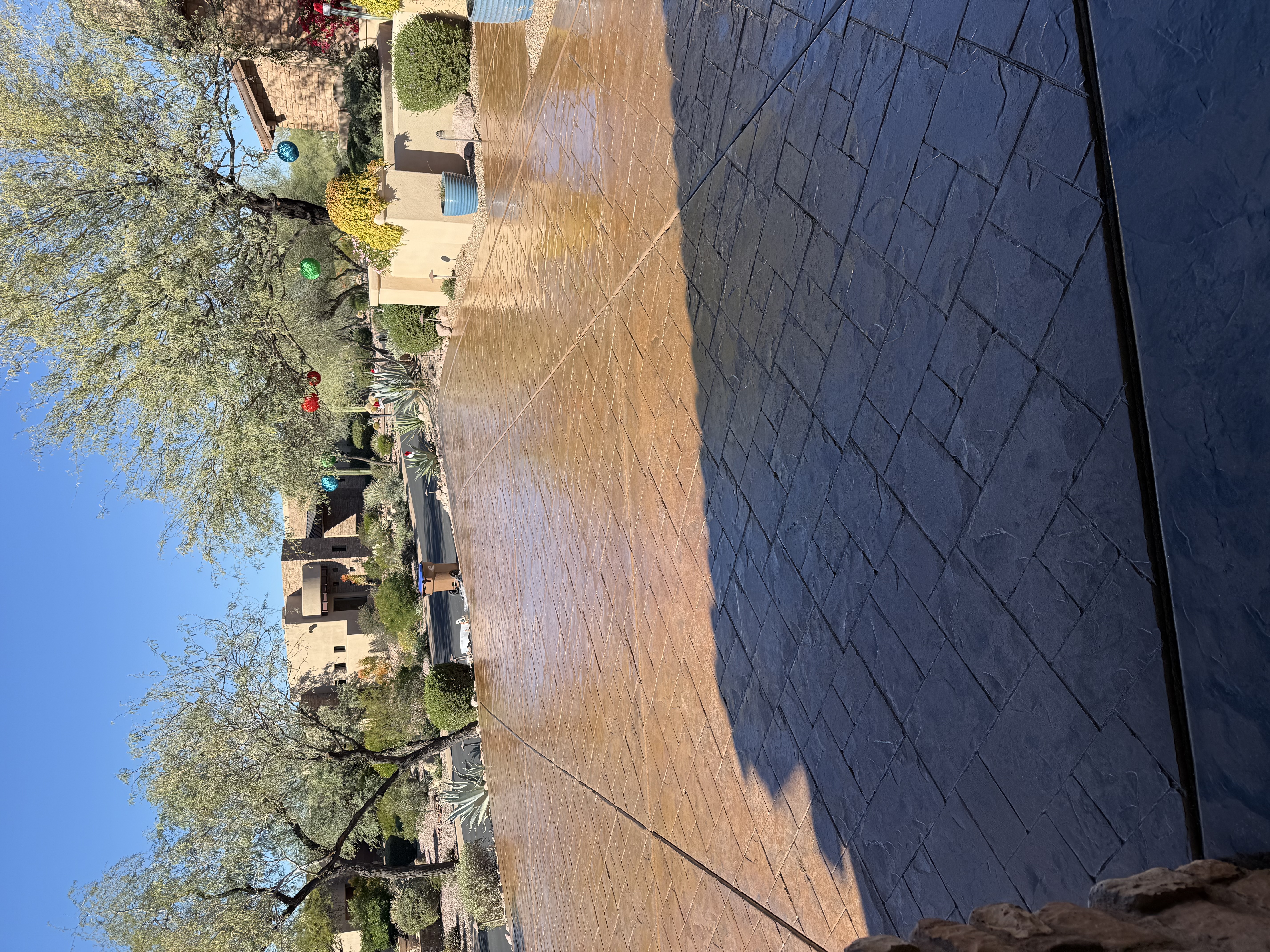 Commercial exterior patio with stamped concrete coating Arizona desert landscaping