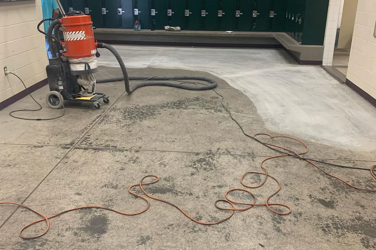Commercial locker room floor grinding preparation with industrial grinder