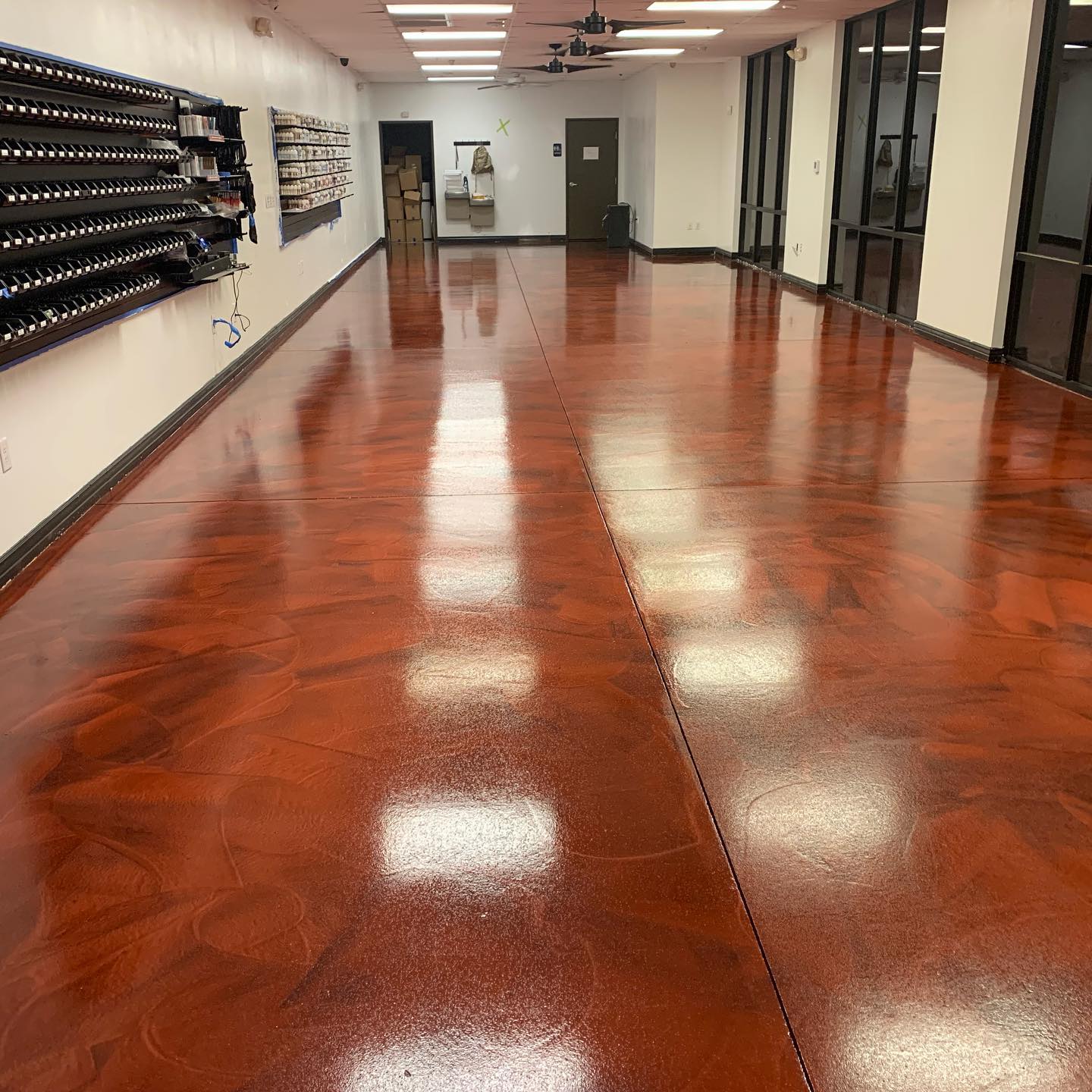 Commercial interior with glossy reddish-brown metallic epoxy floor coating